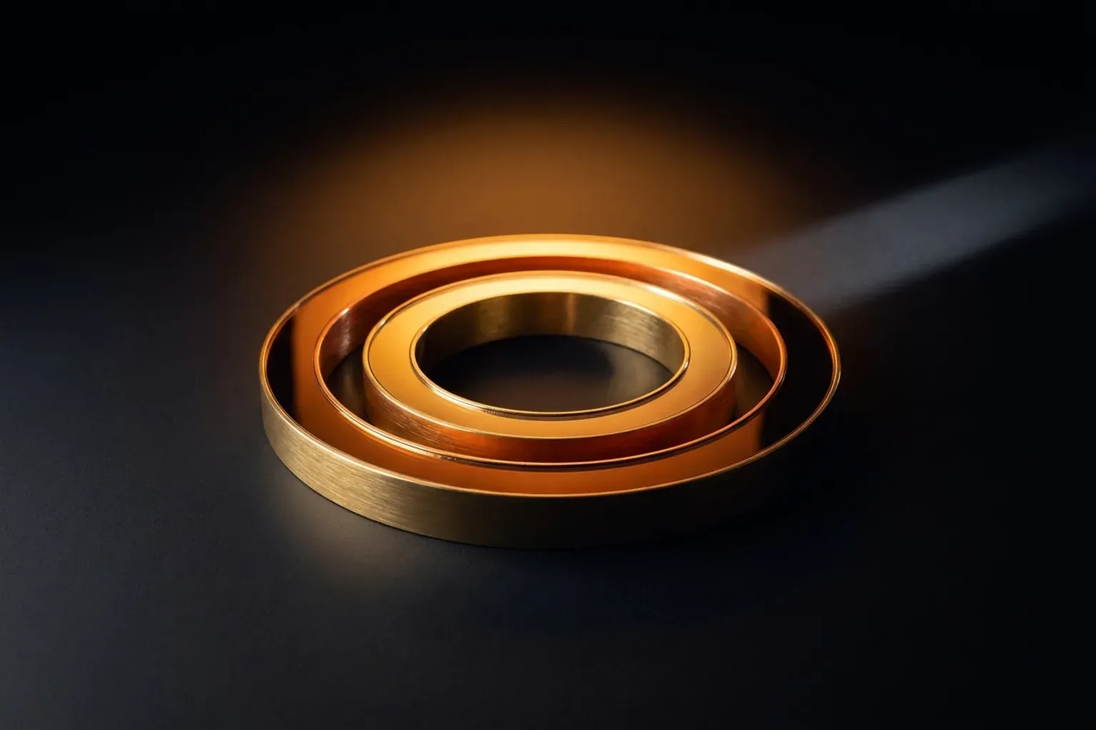 Abstract illustration of two nested glowing rings on a dark field